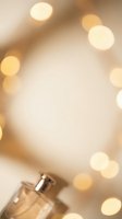 Luxury perfume bottle with warm golden bokeh lights creating elegant festive atmosphere for beauty and fragrance advertising campaigns.