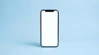 Smartphone with blank white screen isolated on light blue background, ready for app mockup, web design, and marketing presentations.