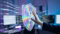 Professional hand touching holographic cybersecurity shield with rainbow spectrum colors in modern tech office environment with digital data streams.