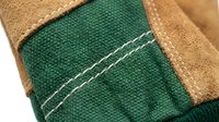 Young man with light skin tone wearing brown leather work gloves with green canvas cuff detail and decorative stitching, suitable for construction, gardening, and labor work.