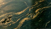 Dark green marble surface with golden veins and natural stone texture patterns for luxury interior design and architectural applications.