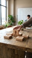 Business professional arranging wooden blocks with employee and training text on office desk during human resources planning session.