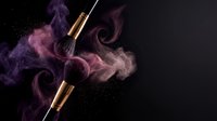 Luxury makeup brushes with swirling purple and pink powder clouds on dark background for cosmetic advertising and beauty product promotion.