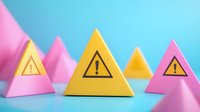 Warning signs on colorful geometric triangular shapes against blue background, minimalist composition with pink and yellow elements creating modern design.
