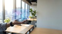Business professional displaying holographic user interface icons in modern office workspace for digital transformation and technology innovation.
