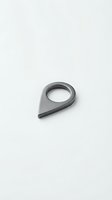 Modern gray metal teardrop ring with hollow center on white background, suitable for jewelry design, product photography, and fashion accessories marketing.