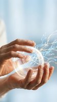 Hands holding glowing digital sphere with flowing light particles and neural network connections against blue sky background, representing technology, innovation, and data transfer for business and digital solutions.