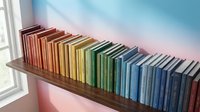 Colorful books arranged on wooden shelf by window with gradient sunset light, representing education, learning, library collection, and knowledge organization for design projects.