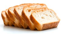 Fresh sliced white bread arranged in row showing soft texture and golden crust on white background, macro food photography for bakery and culinary designs.
