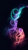 Vibrant neon smoke swirls in cyan, purple and pink colors creating flowing energy patterns against dark background for digital art projects.