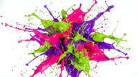 Vibrant paint splash explosion with green, pink and purple colors bursting outward creating dynamic artistic splatter pattern on white background.
