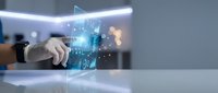 Businessman hand touching holographic digital interface with glowing data visualization and futuristic technology elements in modern office environment.