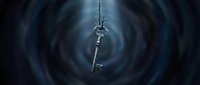 Ornate silver key suspended in swirling dark blue vortex, symbolizing mystery, access, and hidden secrets for fantasy, mystery, and conceptual design projects.