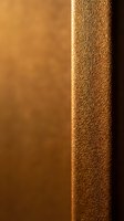 Warm golden leather book spine with textured surface and smooth pages in soft lighting for luxury publishing and literary design projects.