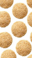 Golden sesame seed circles arranged in pattern on white background, isolated for food packaging design and culinary projects.