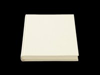 Blank cream hardcover book isolated on transparent background, ready for design use in mockups, stickers, print on demand, and t-shirt design.