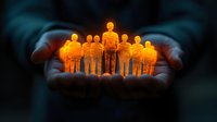 Glowing golden silhouettes of people group held in caring hands against dark background, representing community support, unity and protection concept.