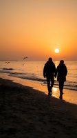 Romantic couple walking hand in hand on beach at sunset with golden sky and seagulls flying overhead creating peaceful seaside atmosphere.