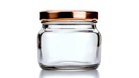 Empty glass jar with copper metallic screw lid isolated on white background, suitable for food storage, preserves, and product packaging designs.