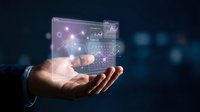 Businessman hand holding holographic digital interface with glowing icons and data visualization for technology, innovation, and business solutions.