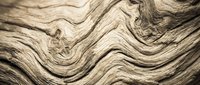 Organic wood grain texture with flowing wavy patterns and natural striations, suitable for backgrounds, design elements, and surface applications.