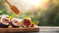 Fresh ripe figs cut in half on wooden board with honey dripping from dipper, natural sunlight background creates warm atmospheric food composition.