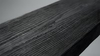 Dark weathered wood plank with natural grain texture and rustic surface details for construction and carpentry projects.