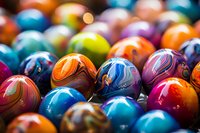 Vibrant collection of colorful marbles with swirling patterns and designs captured in macro photography, showing intricate details and light reflections on glossy surfaces.