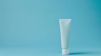 White cosmetic tube on turquoise gradient background for skincare product packaging and beauty brand marketing materials.