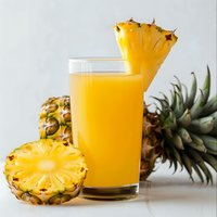 Fresh pineapple juice in glass with cut tropical fruit on white background, bright natural drink and raw organic pineapple slices for healthy lifestyle.