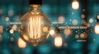 Vintage Edison bulb glowing with innovation and creativity text overlay on bokeh background for bright business ideas and entrepreneurship concepts.