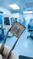 Microchip held by tweezers in modern laboratory setting for semiconductor research and electronic component development in clean room environment.