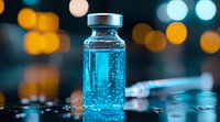 Medical vial with blue liquid and syringe on dark background with bokeh lights, pharmaceutical research concept for vaccination and medicine development.
