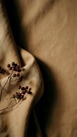 Dried red berries on draped beige linen fabric with soft shadows, earthy autumn tones for lifestyle, home decor, and wellness branding.