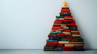 Stacked books arranged in Christmas tree shape with golden star on top against white wall, creative holiday literature concept for libraries and bookstores.