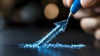 Glowing blue arrow drawn with magical sparkles emerges from pen tip against dark background, creating luminous trail of light particles for business concept.