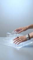 Hands interacting with holographic digital interface displaying futuristic data visualization and virtual reality elements for modern technology concepts.
