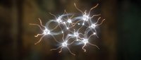 Glowing neural network with interconnected neurons and synapses showing brain activity and electrical impulses on dark background for medical education.