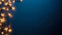 Glowing warm fairy lights creating magical border on dark blue background, festive holiday illumination for seasonal decorations and celebrations.