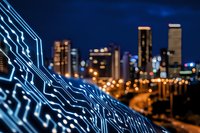 Futuristic cityscape with glowing circuit board pattern in foreground against blurred urban skyline at night, highlighting technology and modern architecture.