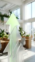 Stacked translucent tree shapes in soft green and frosted tones, displayed in bright modern interior with potted plants and natural light from windows.