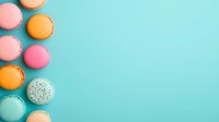 Colorful French macarons arranged in curved line on turquoise background. Sweet pastel meringue cookies in orange, pink, mint creating minimalist composition.