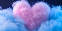 Pink heart shaped cloud formation against blue misty background, romantic atmospheric composition with soft dreamy texture and ethereal lighting effects.