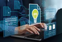 Professional working on laptop with digital innovation interface featuring lightbulb icon, semantic search tools and data visualization elements.