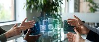 Business team collaborating around holographic digital technology interface with global connectivity icons in modern office environment.