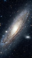 Spectacular spiral galaxy with bright central bulge and detailed spiral arms against starfield background for astronomy and space science projects.