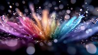 Vibrant rainbow color explosion with sparkling particles and bokeh lights radiating from center creating dynamic burst effect on dark background.