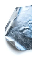 Crumpled metallic foil with reflective surface and textured patterns isolated on white background for packaging design and creative projects.