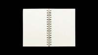 Spiral bound notebook with blank cream pages, isolated on transparent background. Ready for stationery design, print on demand, clipart, sublimation, and digital crafts.