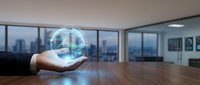 Businessperson holding glowing digital globe in modern office with city skyline view, representing global connectivity, international business, and worldwide network technology solutions.